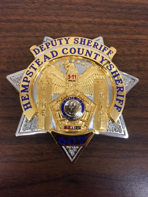Hempstead County Sheriff's Office badge sitting on table