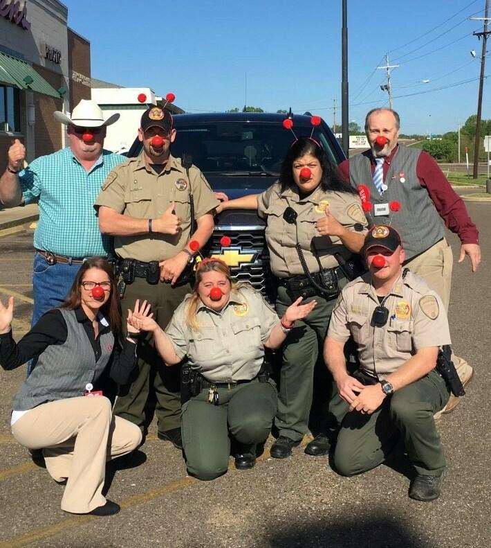 Group of officers wearing red noses