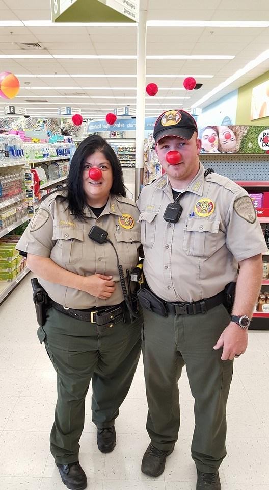 A couple of deputies wearing red noses