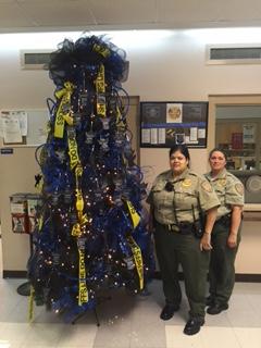Officers standing with Blue Line Tree