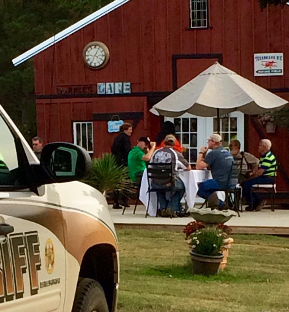 Sheriff and Deputies eating a steak and shrimp dinner