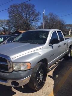 front side view of silver Dodge truck