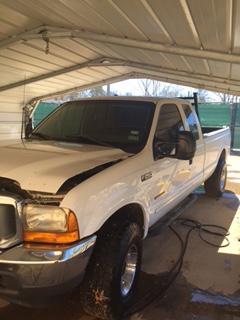 front driver's side view of white truck