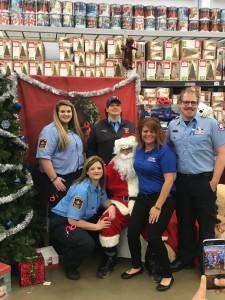 Sheriff's Office staff sitting on Santa's lap