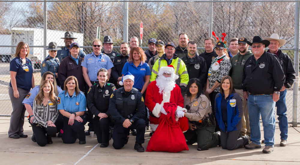 Sheriff's Office staff with Santa Claus