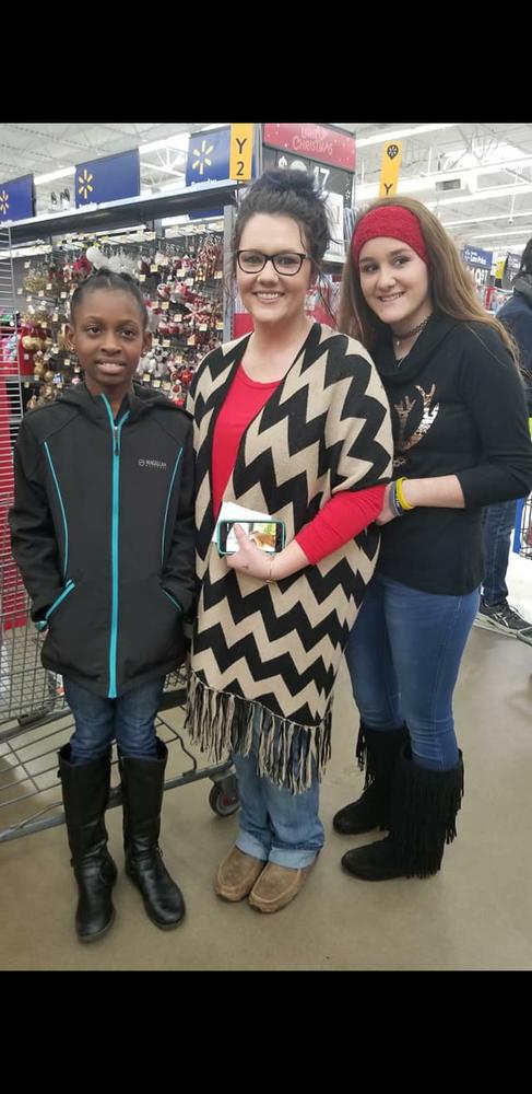 3 Girls receiving gifts