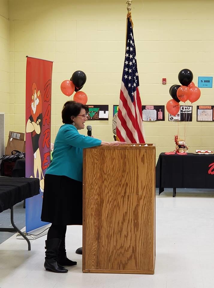 Woman speaking at podium