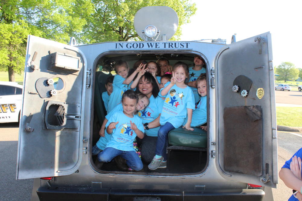 GMCS students sitting inside sheriff's armored vehicle